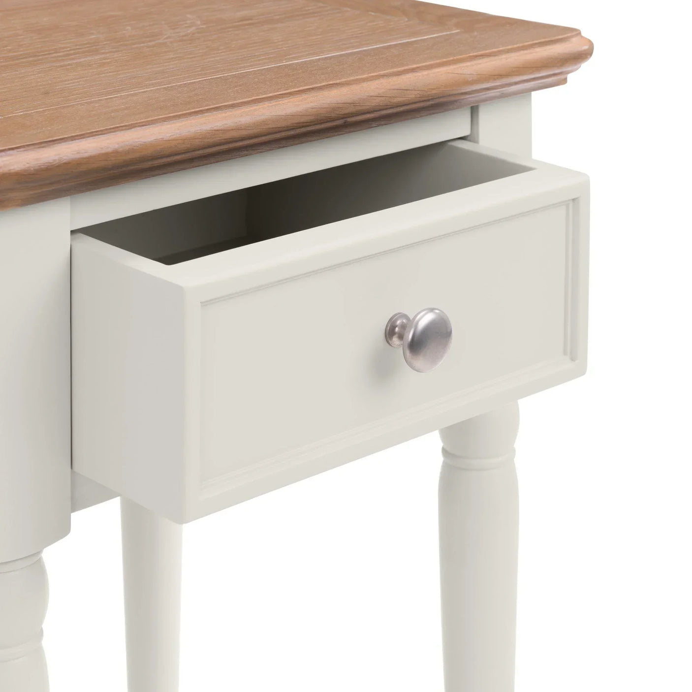 Cream bedside table with wooden top and open drawer, round metal handle, turned legs