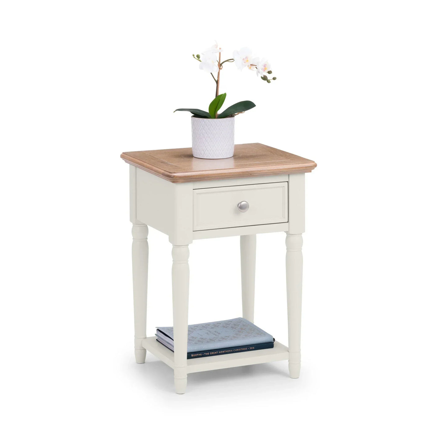 Cream and oak bedside table with single drawer, lower shelf, potted plant and books