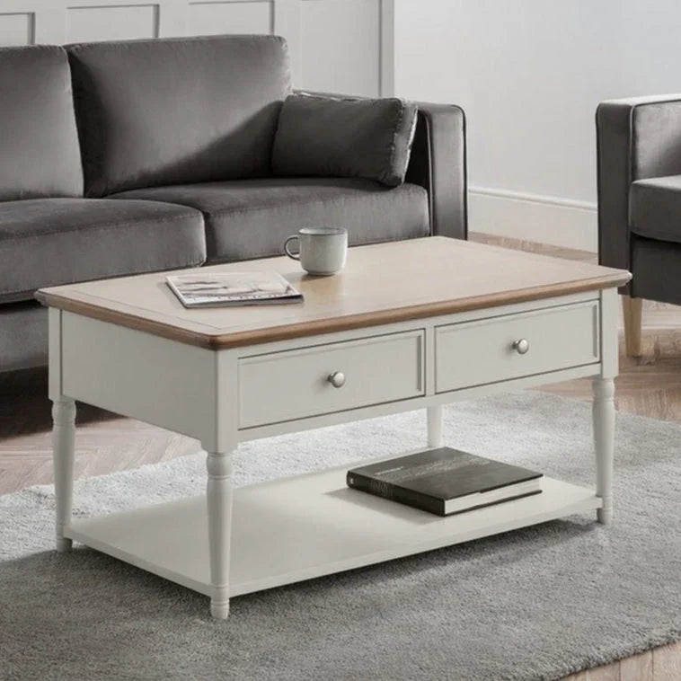 Provence coffee table with drawers, light wood top, and lower shelf in modern living room