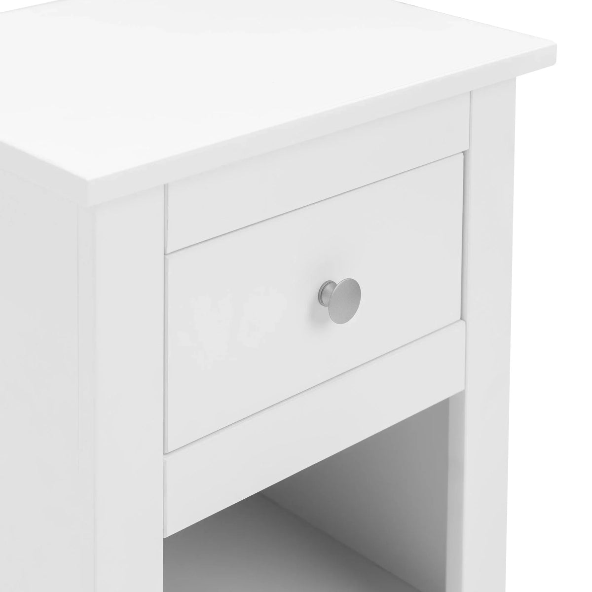 White bedside table with single drawer and open shelf, close view of drawer handle