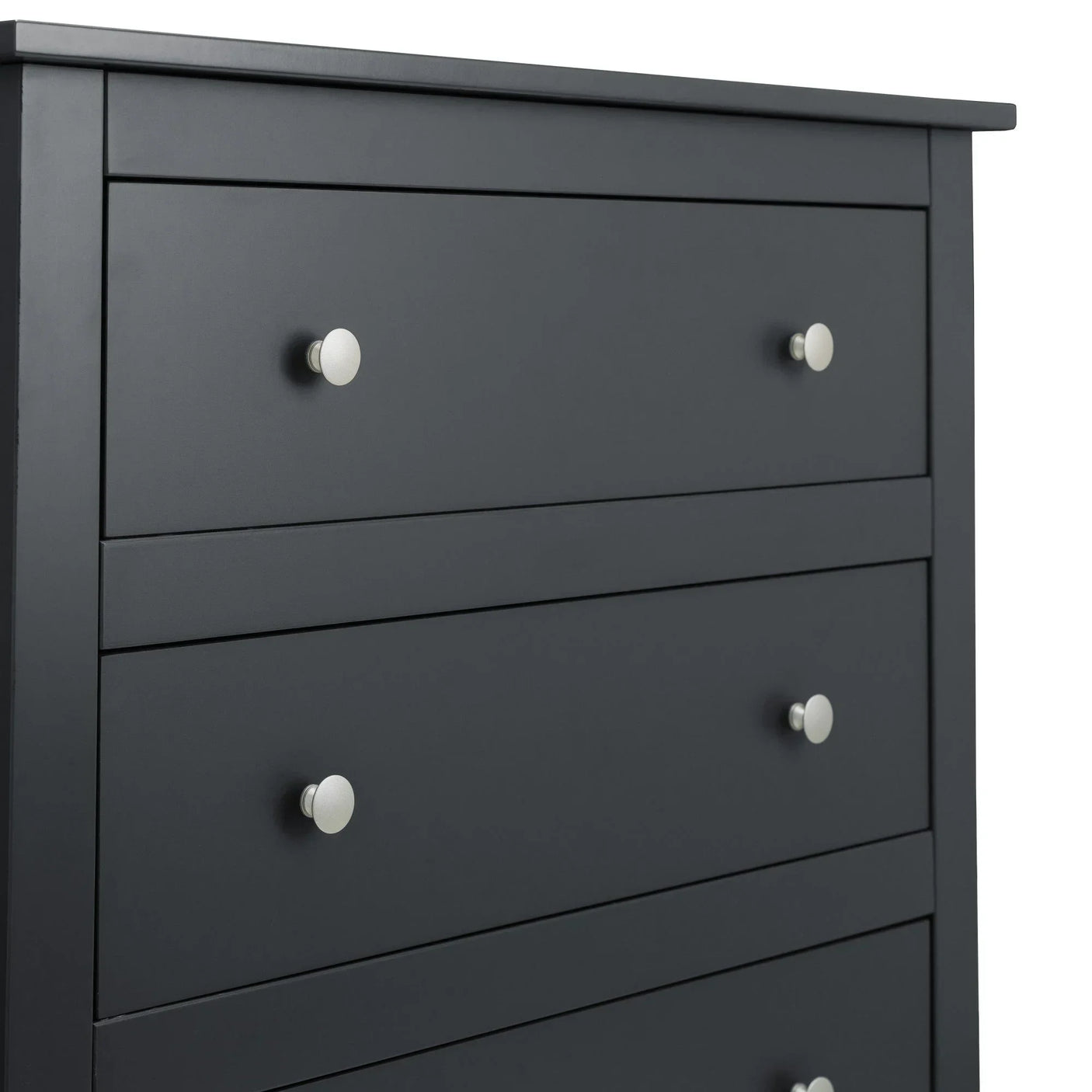 Matte black chest of drawers with silver metal knobs, close-up of drawer fronts