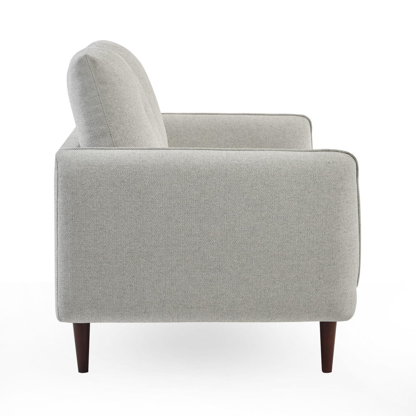 Side view of light grey fabric sofa with wooden legs and box armrest