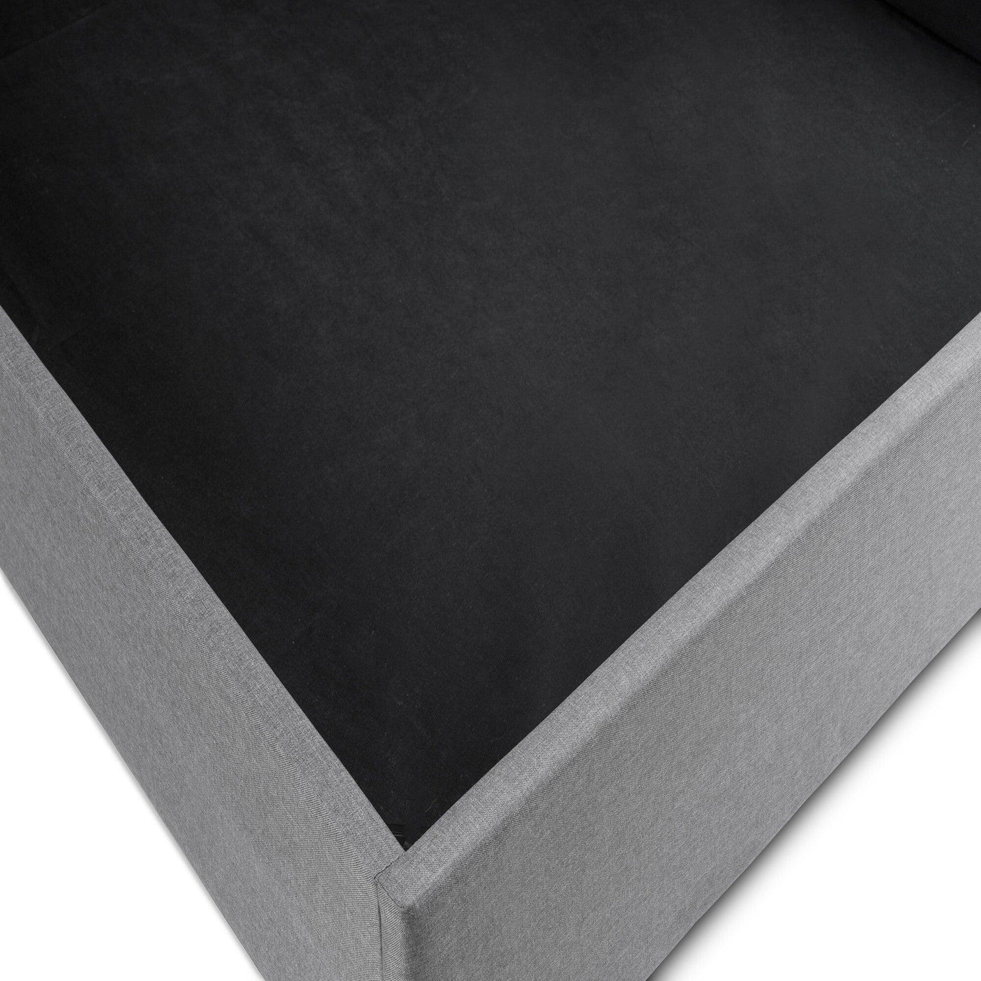 Close-up of lift-up storage bed base in grey fabric finish