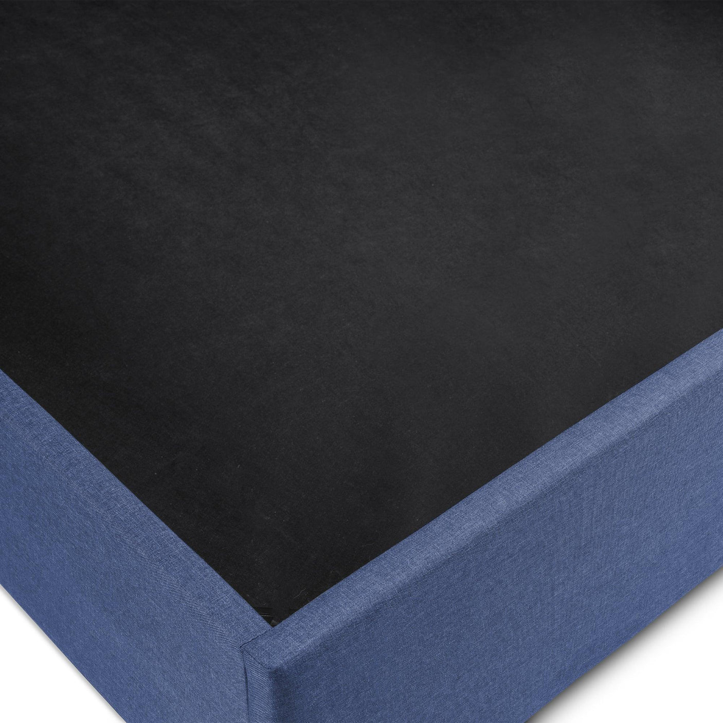 Blue fabric storage bed base corner showing lift-up mechanism detail