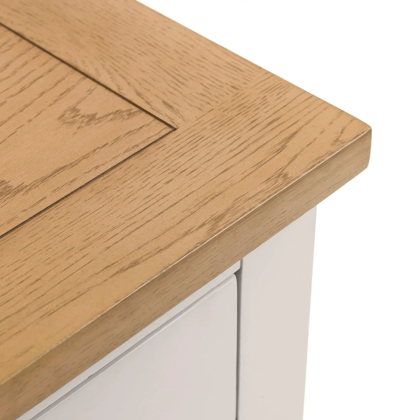 Oak wood furniture top corner with light painted side panel close up