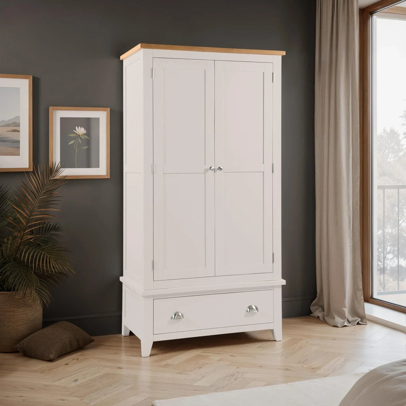 White wooden wardrobe with lower drawer and oak top in modern bedroom