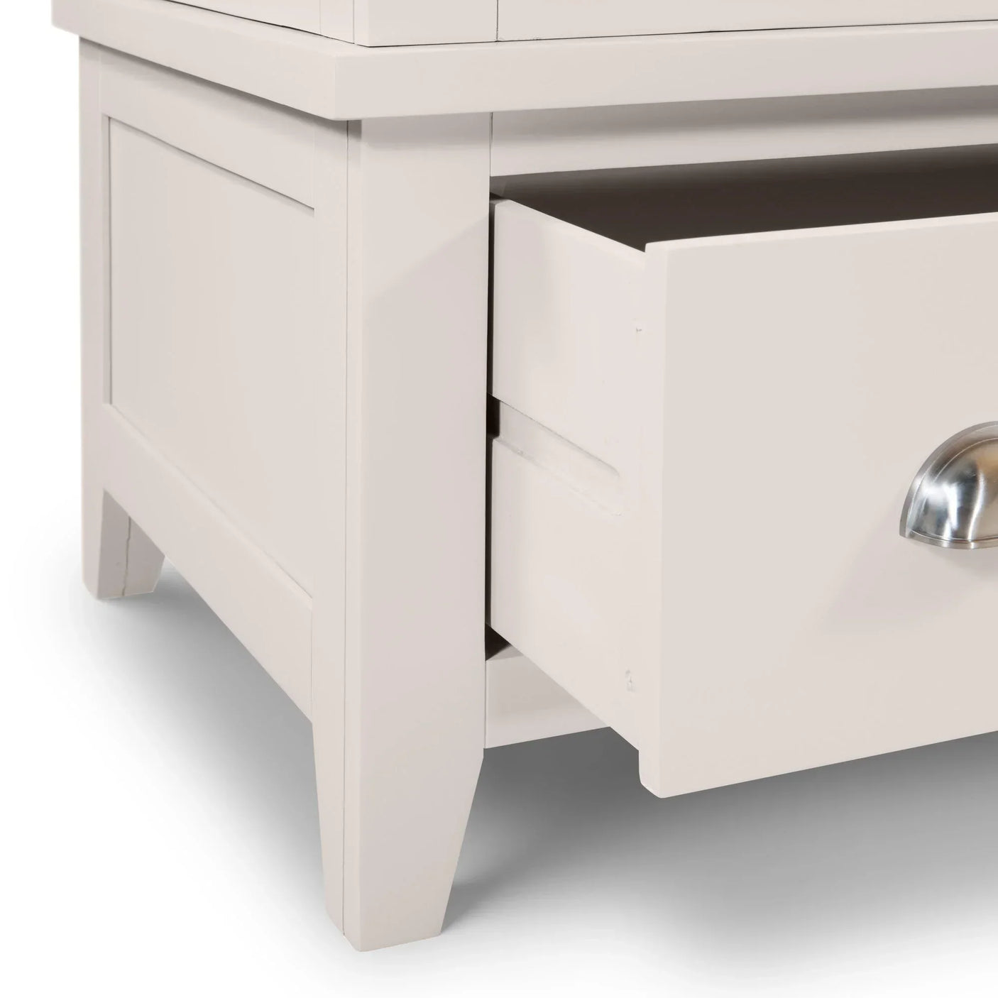 White wooden bedside cabinet with open drawer and metal cup handle