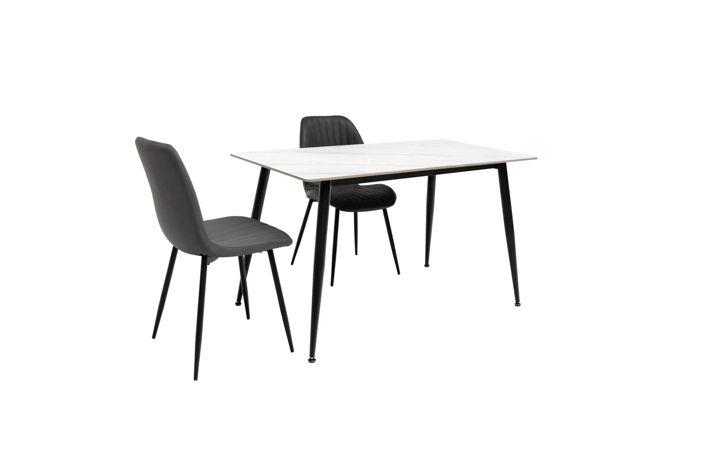 Black dining chairs with slim metal legs and marble effect dining table, angled view