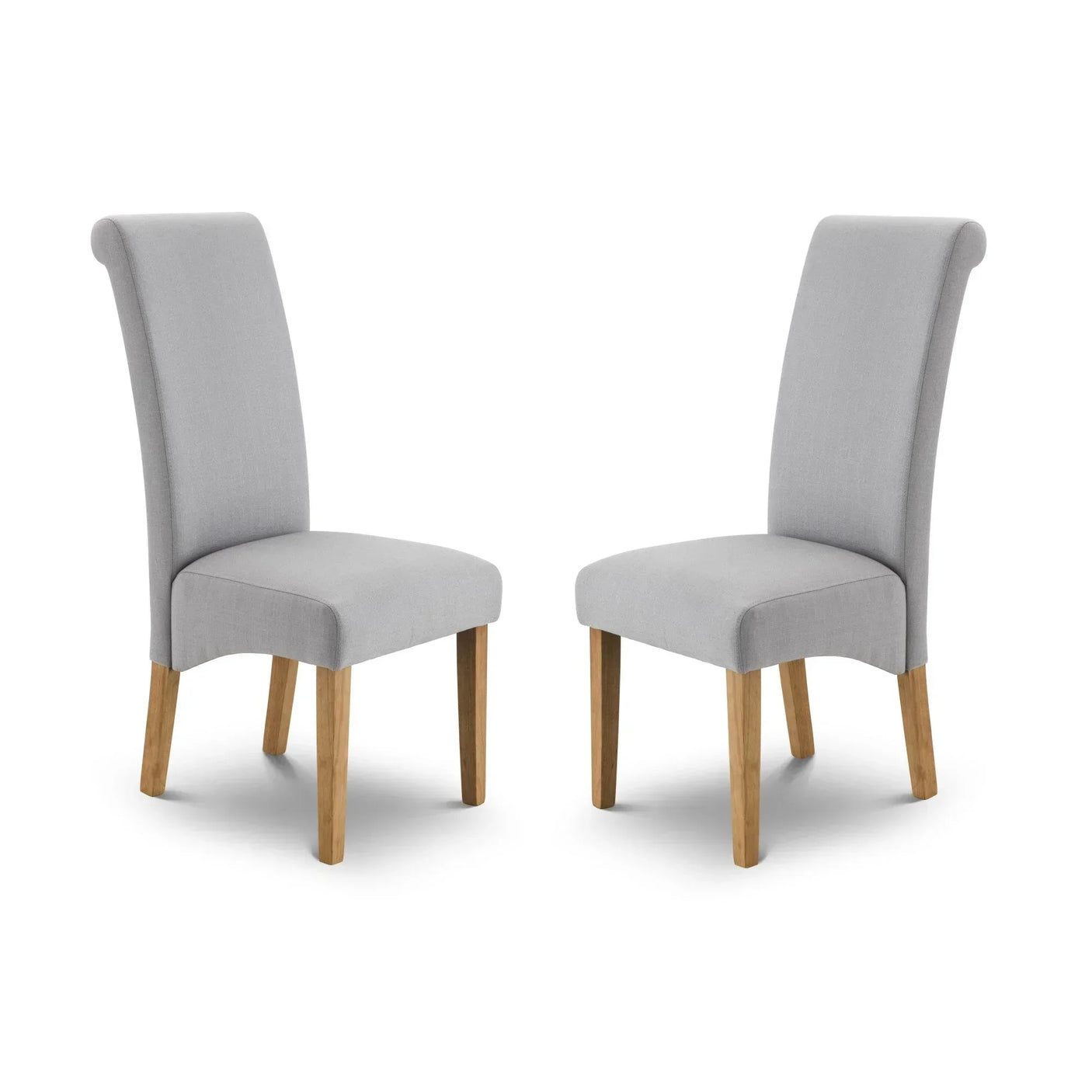 Pair of grey upholstered dining chairs with wooden legs on white background
