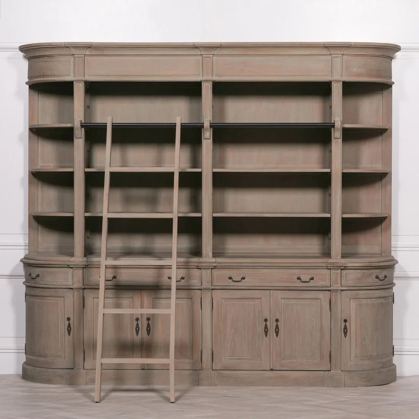 Large wooden bookcase with adjustable shelves, lower cabinets, and sliding library ladder