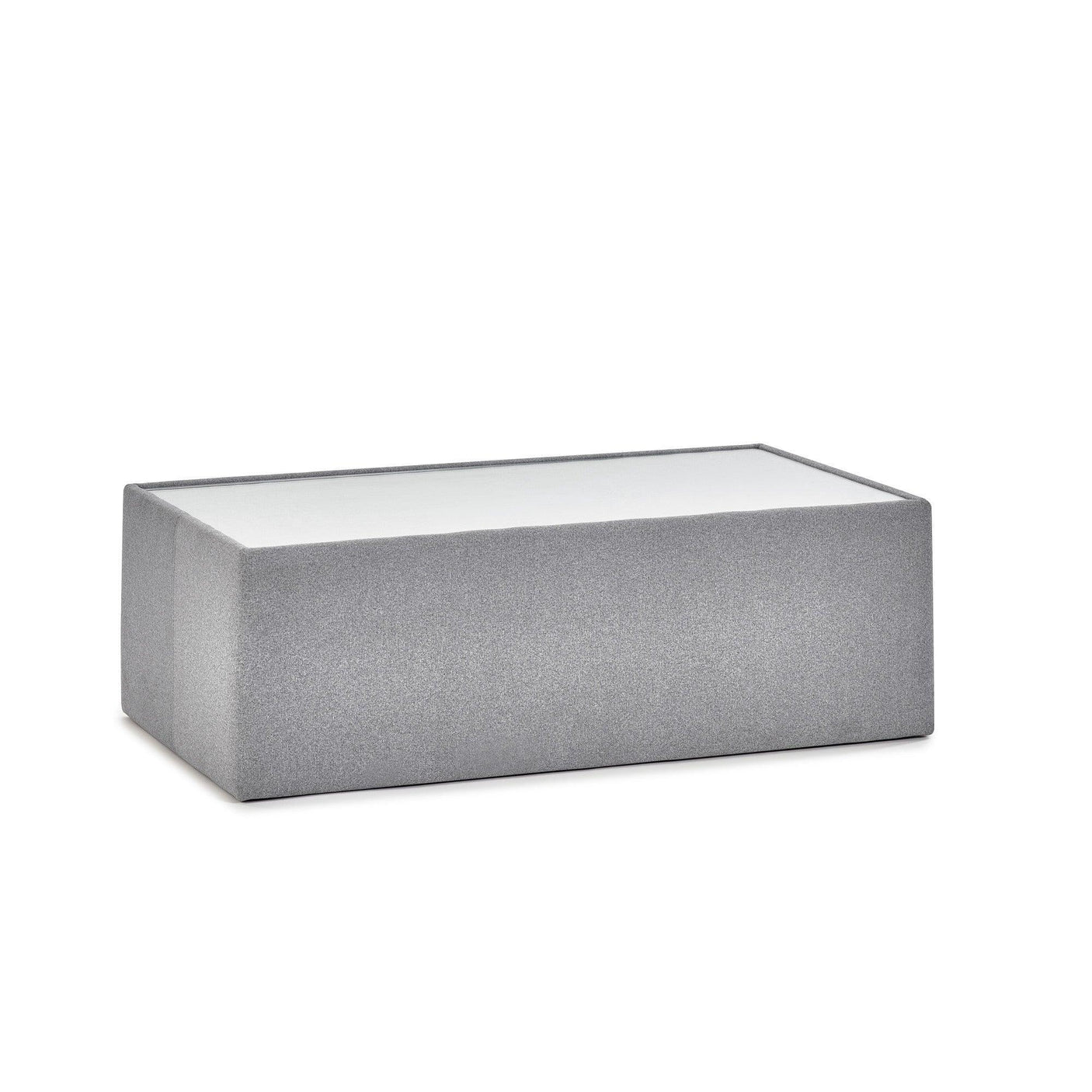 Rectangular grey ottoman with fabric upholstery and minimalist design on white background