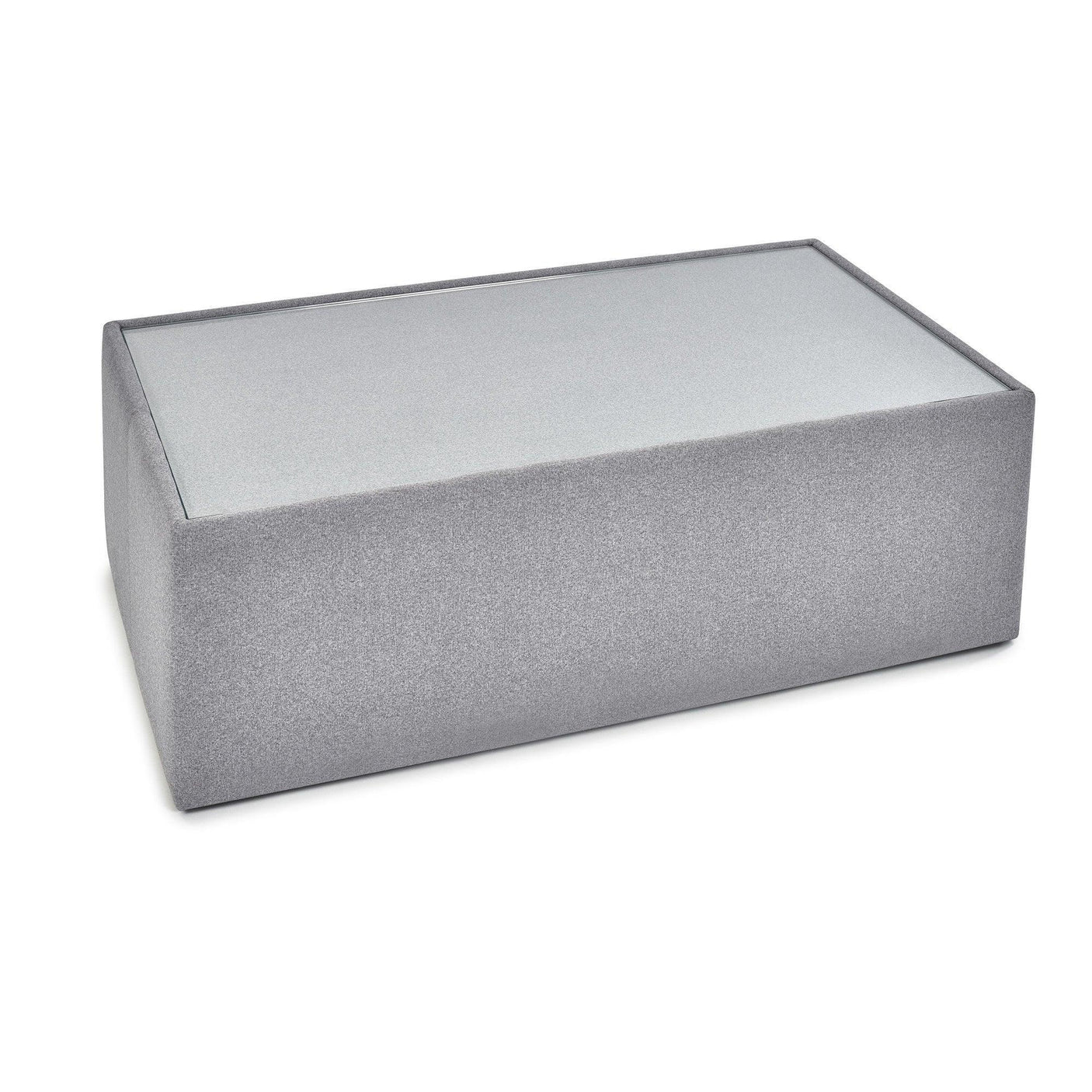 Rectangular grey upholstered ottoman with smooth fabric and flat top surface