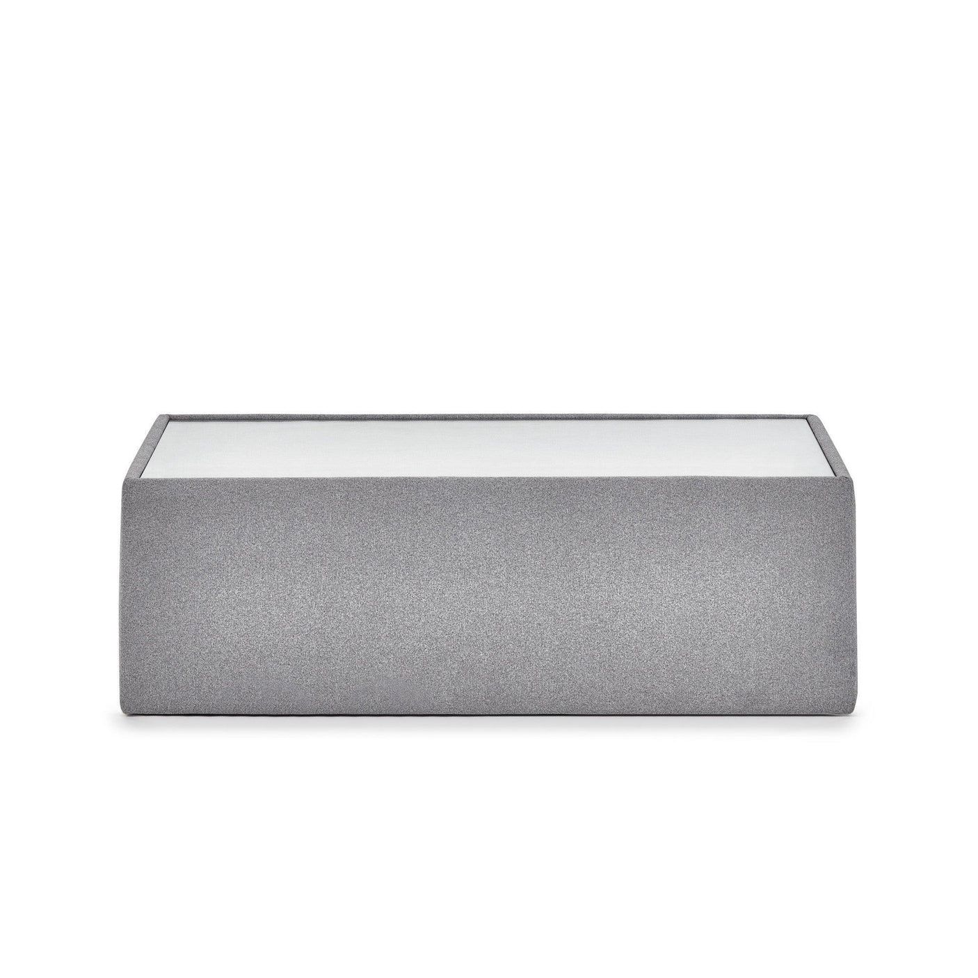 Grey fabric ottoman coffee table with white top, front view against white background