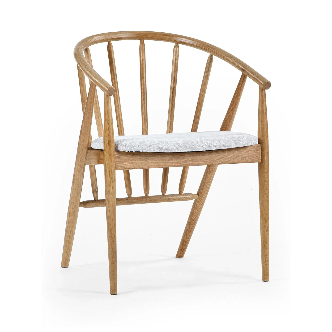 Oak dining chair with curved spindle back and light fabric cushion