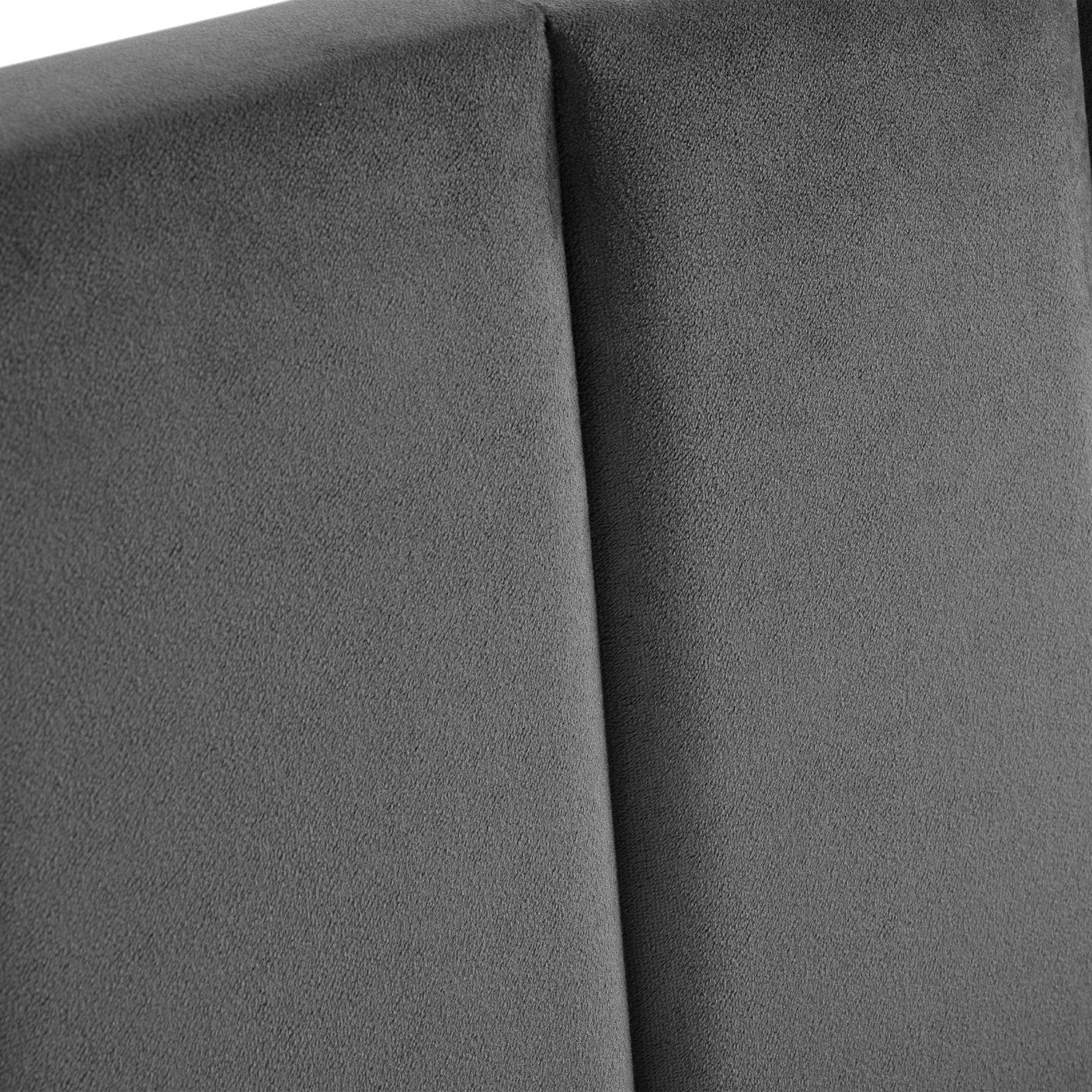 Grey velvet single bed headboard detail with soft textured upholstery