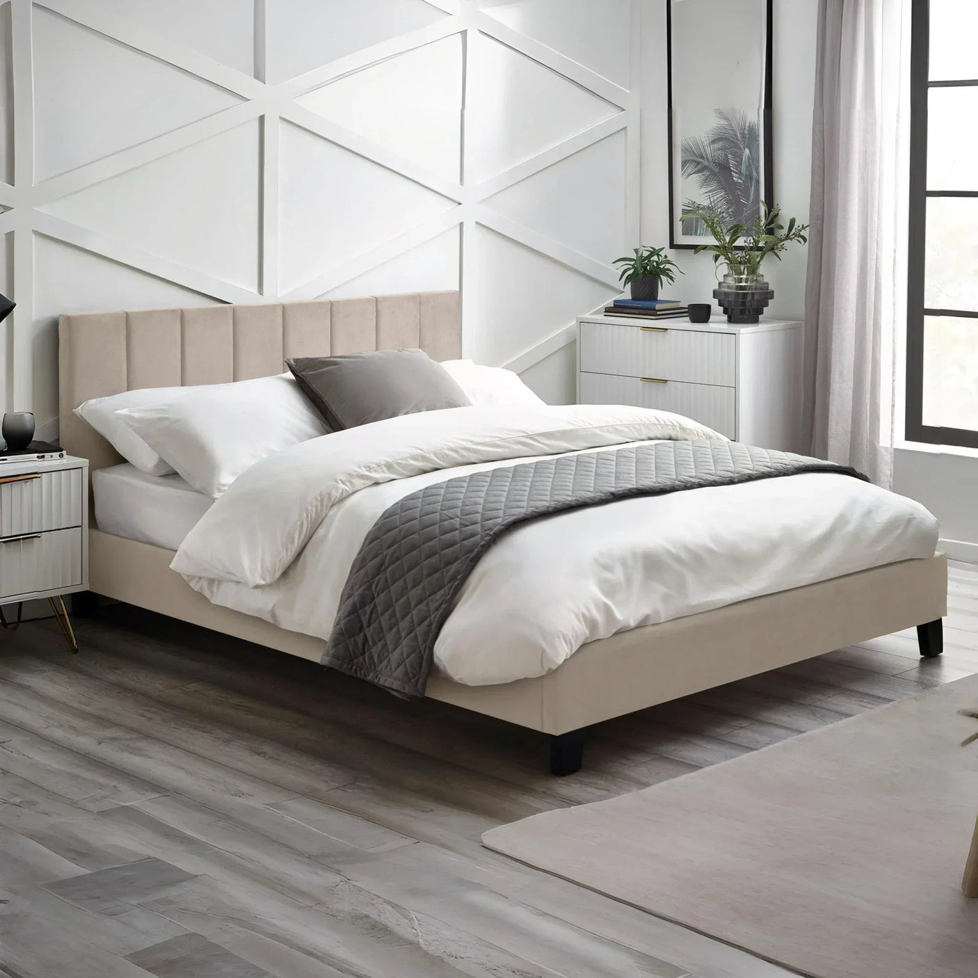 Beige upholstered bed frame with vertical panel headboard in modern bedroom setting
