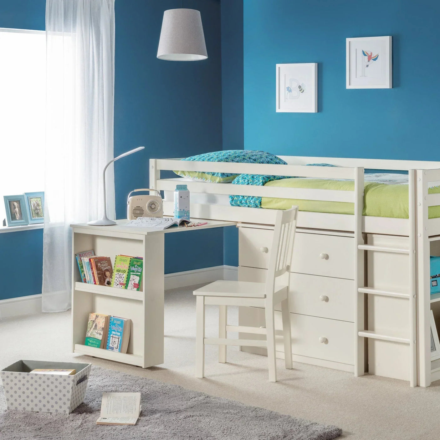 White sleepstation bed with built-in desk, drawers, ladder and shelving in kids' blue bedroom