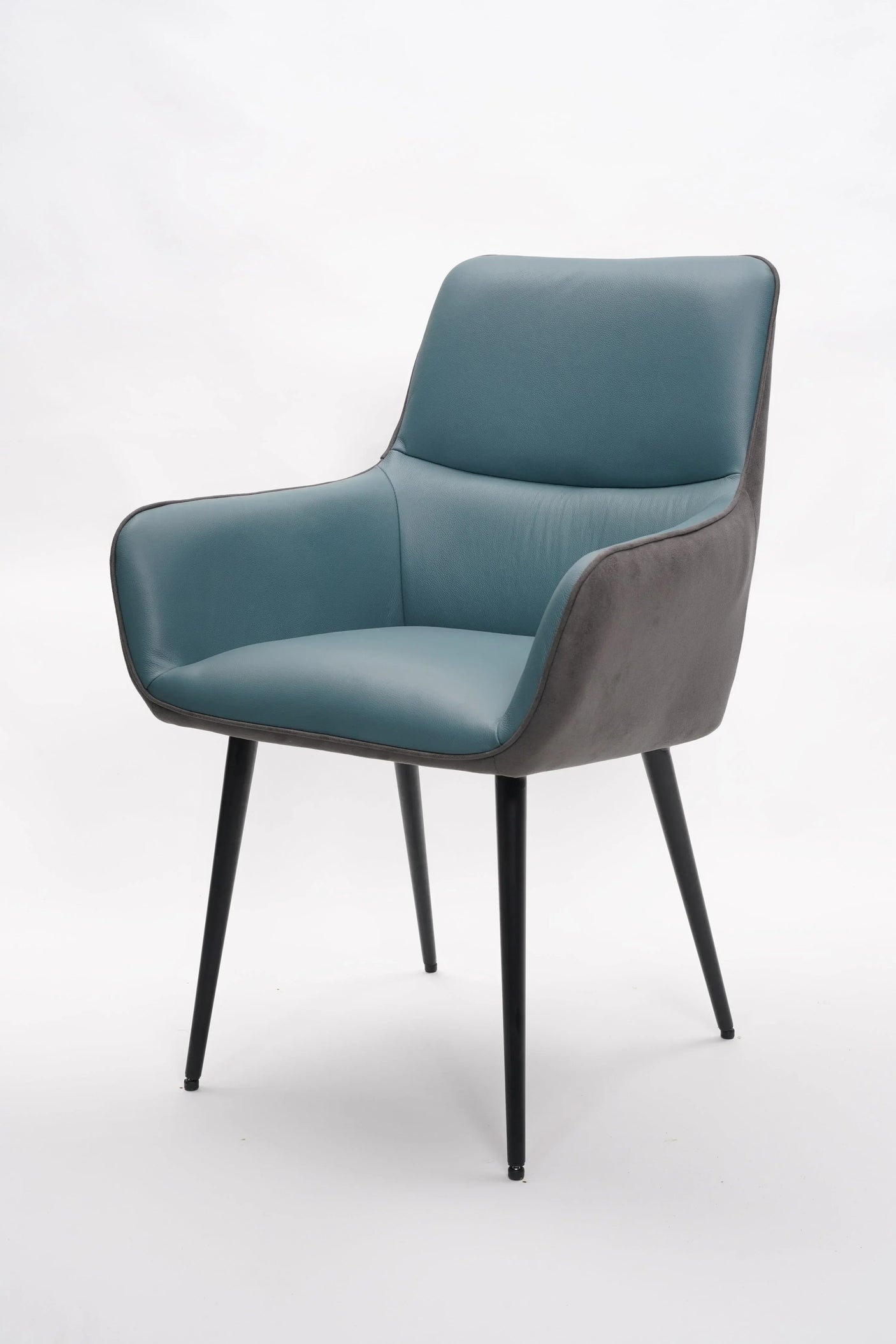 Blue leather dining chair with armrests and black legs on white background