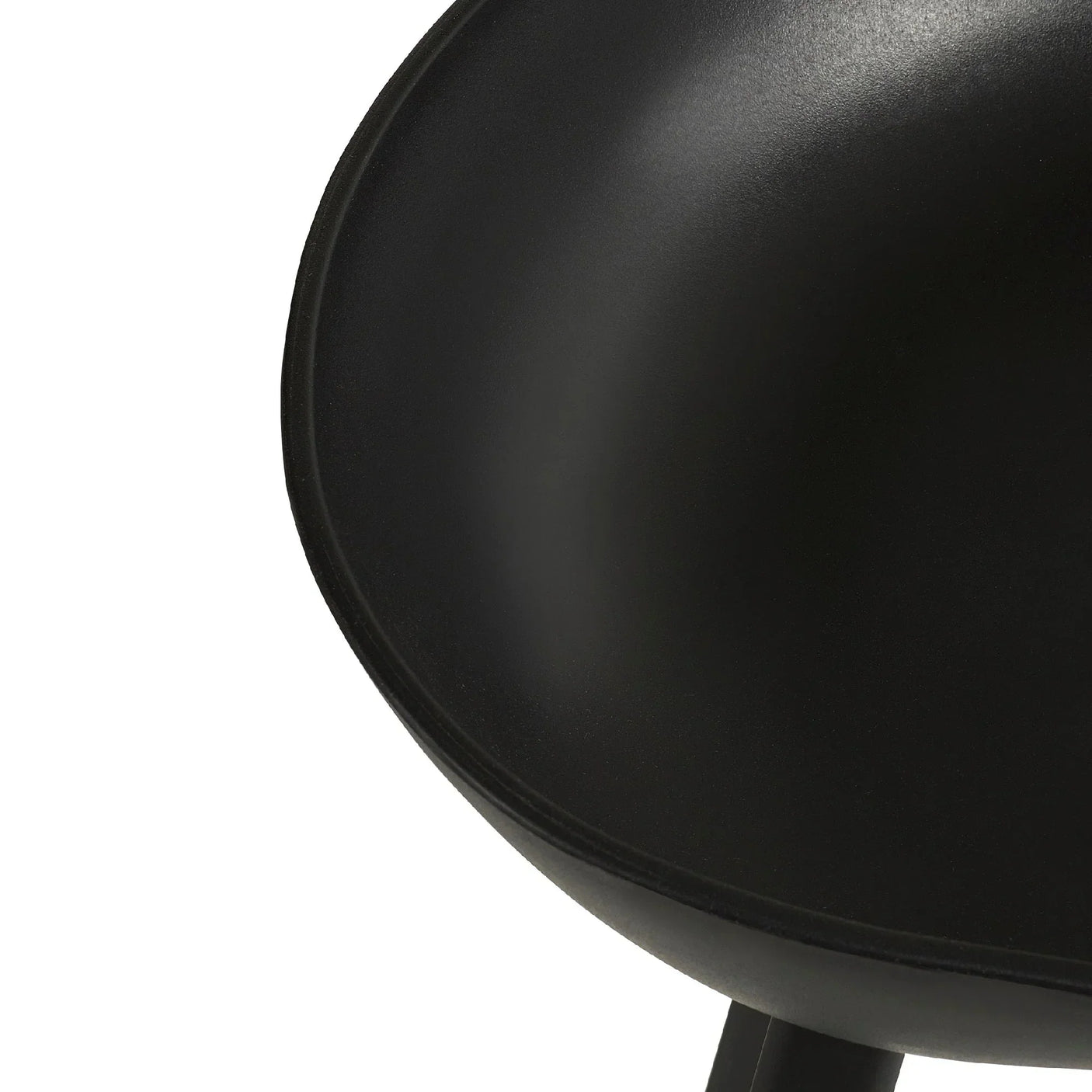 Curved black bar stool seat detail with smooth matte finish