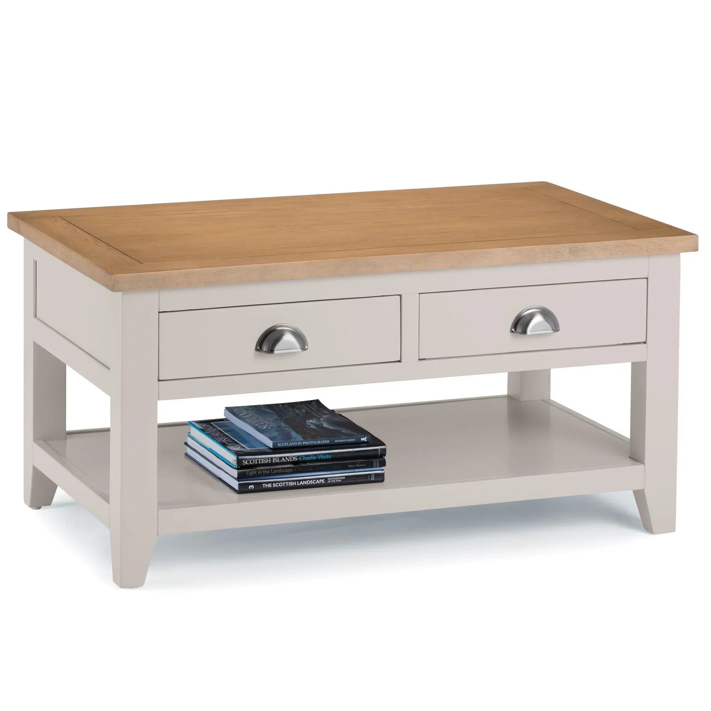 Two drawer coffee table with oak top, white base, metal handles and lower shelf with books