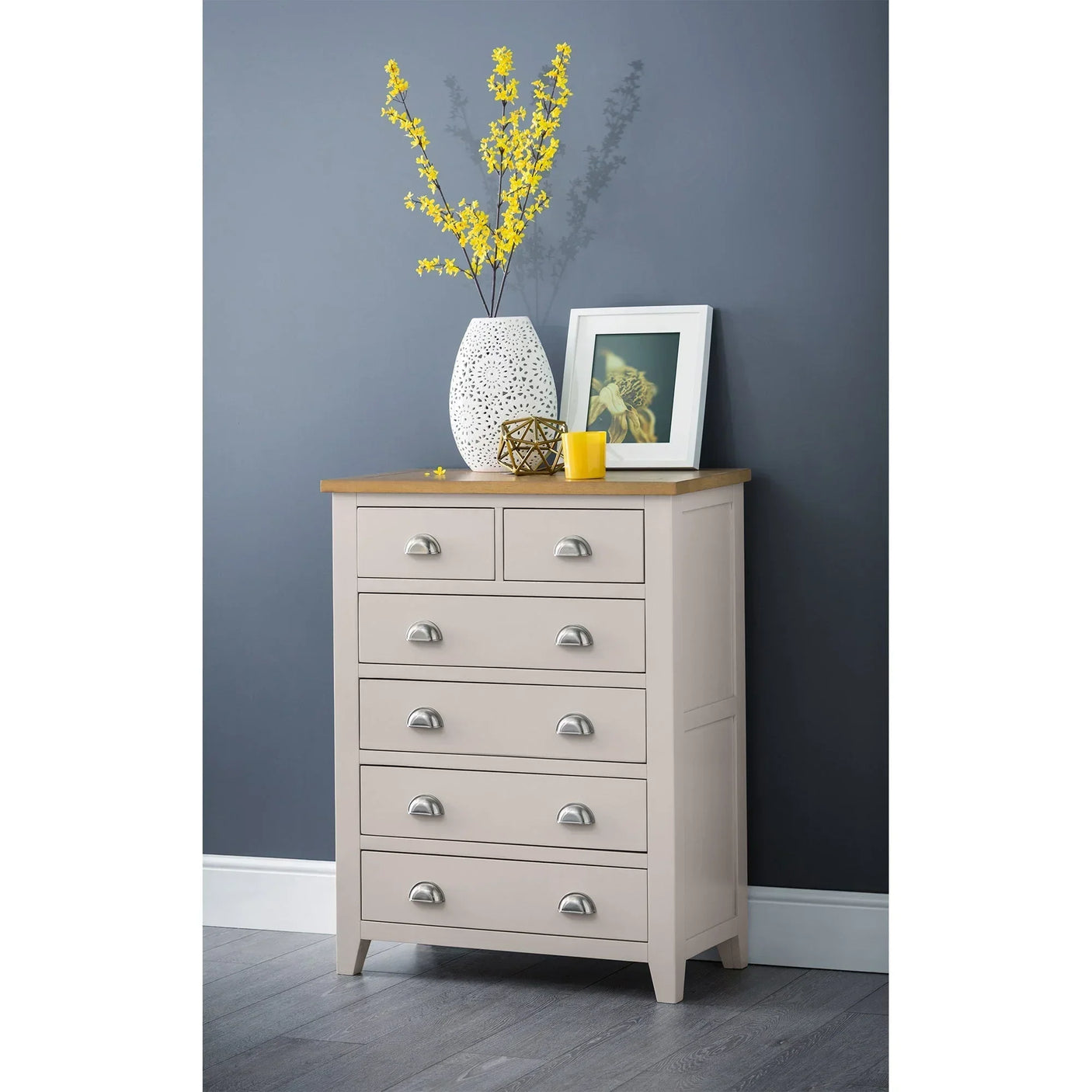Cream 4+2 drawer chest with wooden top, silver handles and decor in modern bedroom