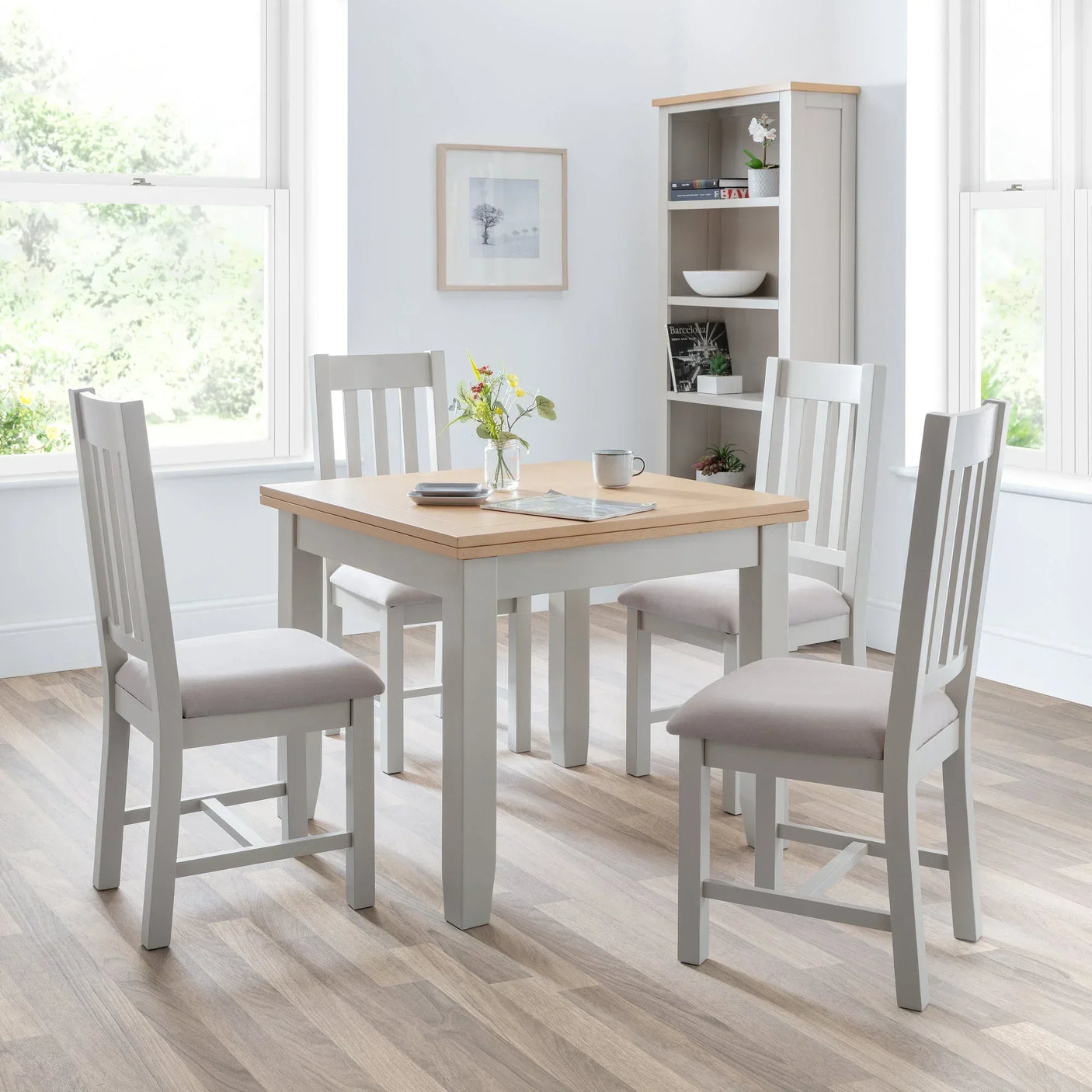 Richmond flip-top dining table with four grey chairs in a bright modern dining room
