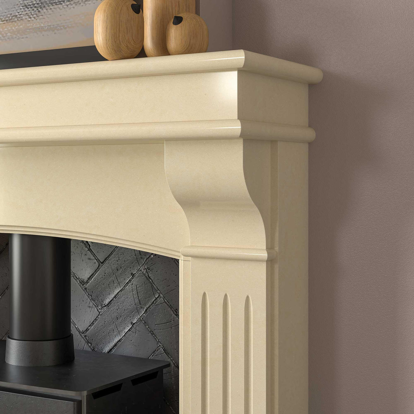 Close up of cream stone fireplace mantel with carved detail and textured brick interior