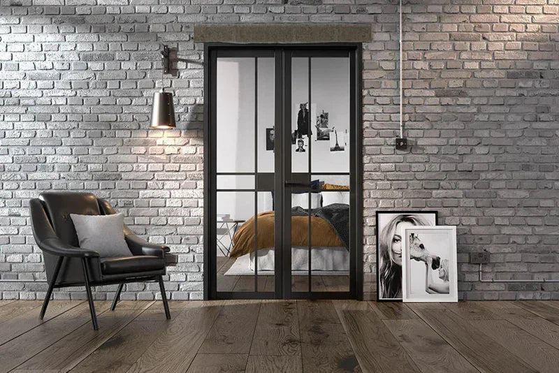 Black room divider with glass panels in modern living space, grey brick wall and wooden floor