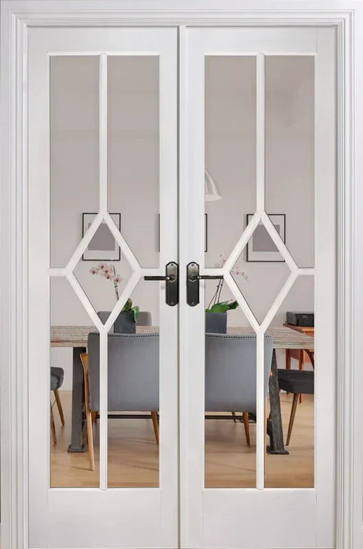 White room divider with glass panels and diamond lattice design in modern dining space