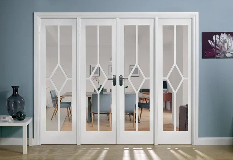 White glass room divider with geometric design between living and dining spaces
