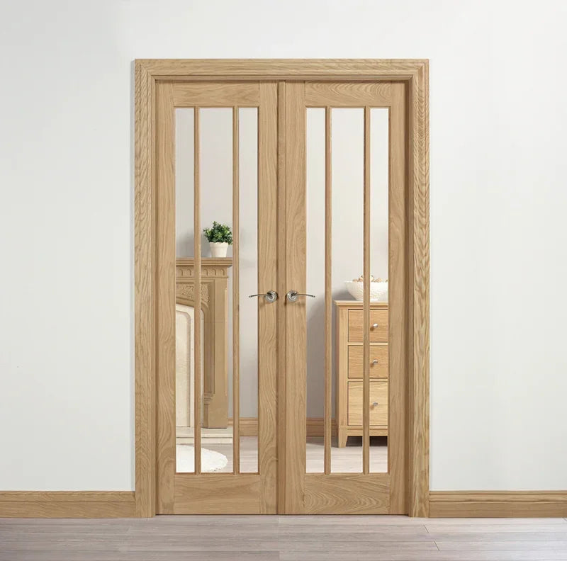 Oak room divider doors with clear glass panels shown in a modern interior setting