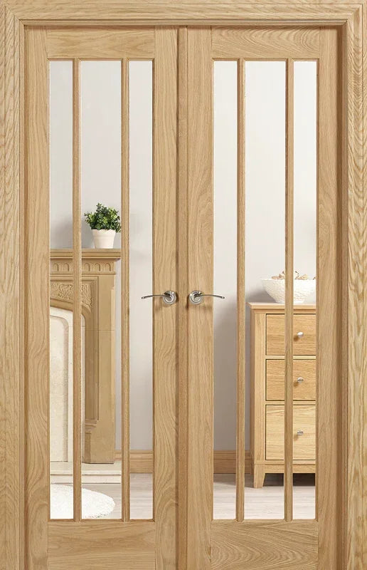 Oak room divider doors with vertical glass panels in lounge setting