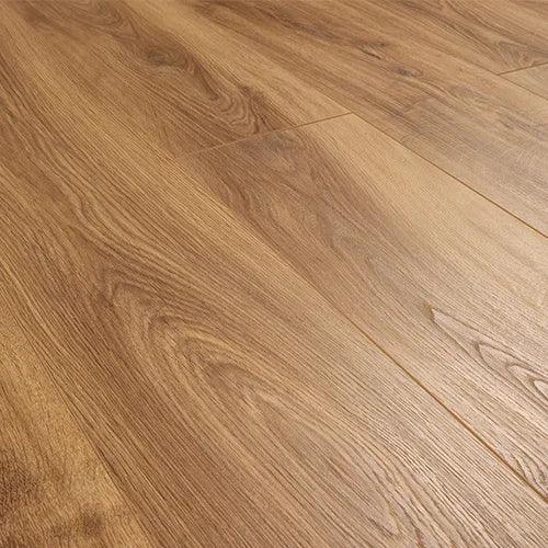 Light oak laminate flooring planks with natural wood grain texture in close-up view