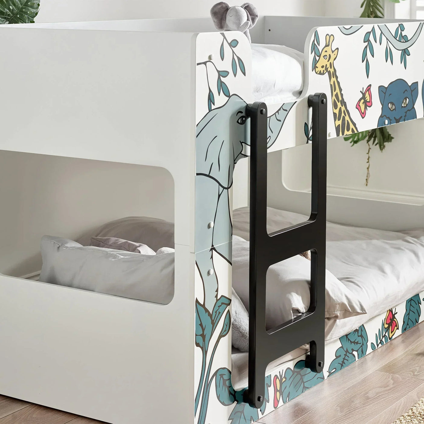 Safari bunk bed with animal illustrations and ladder in a children's bedroom