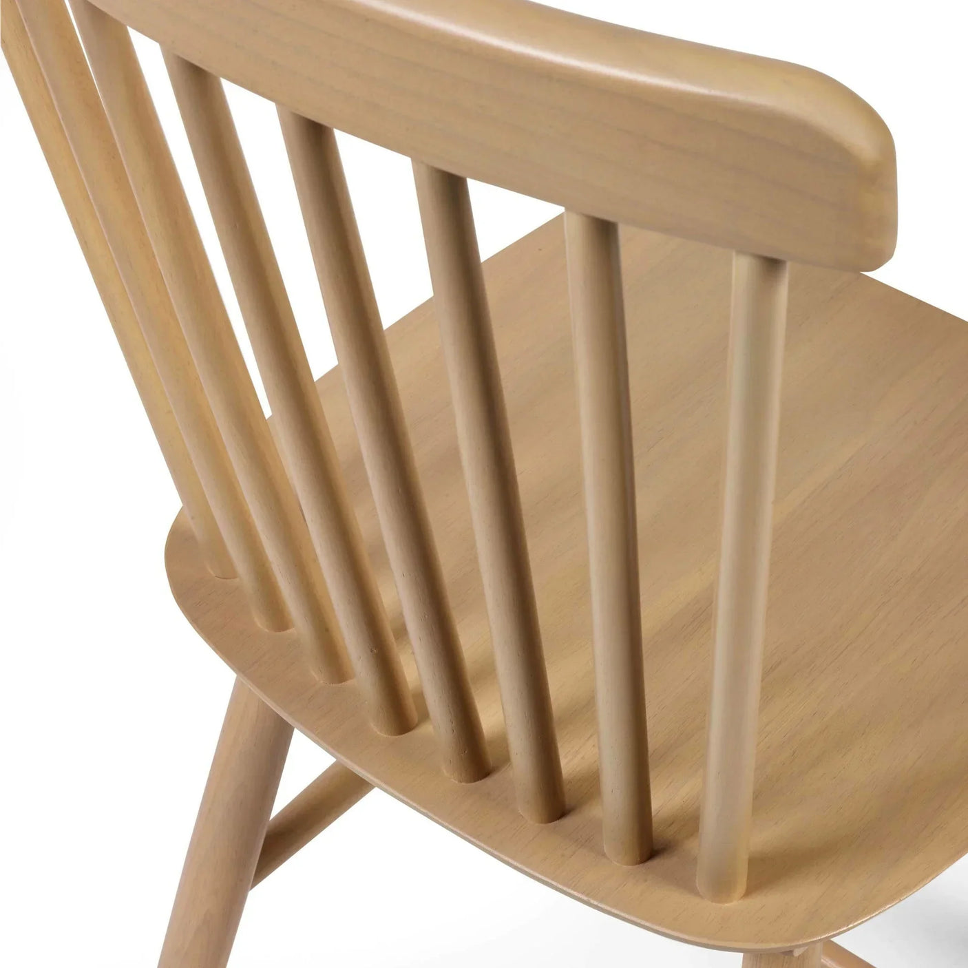 Light oak dining chair closeup showing wooden backrest spindles and smooth seat finish