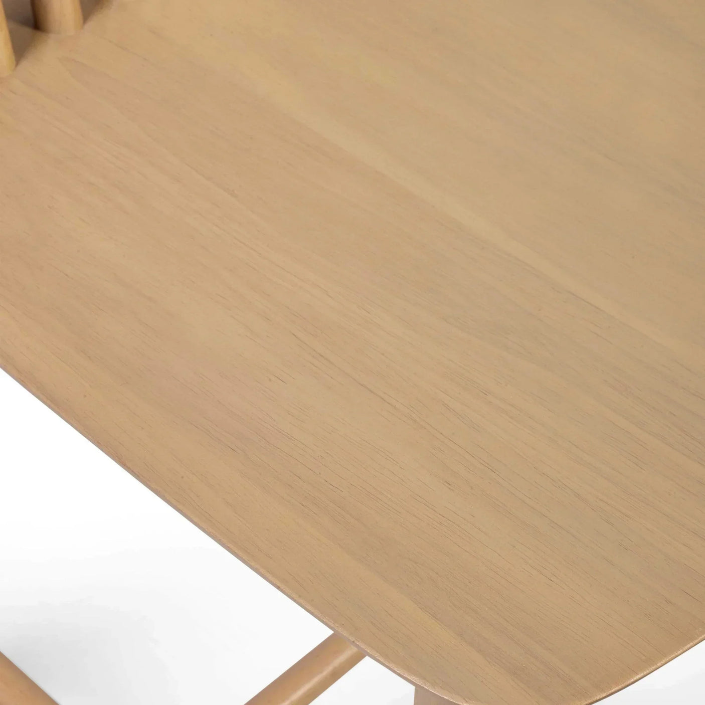 Close-up of light wood dining chair seat with smooth grain finish