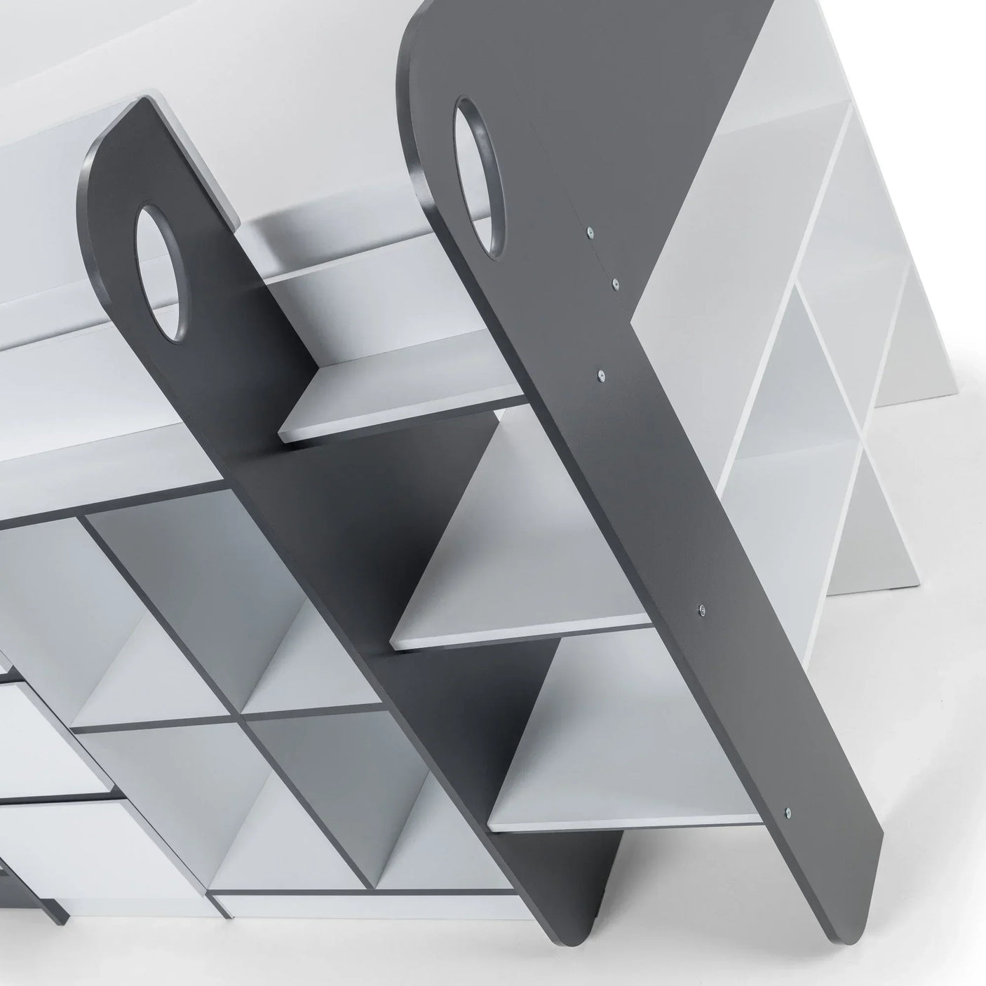 Modern grey and white shelving unit with open compartments and angled side supports