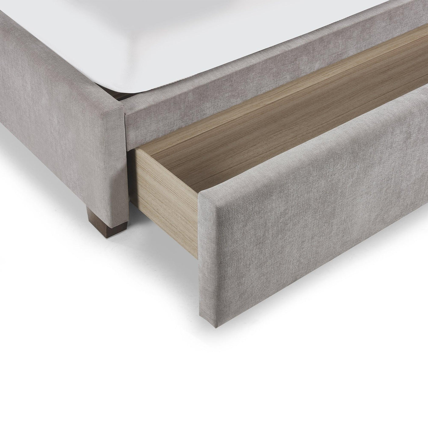 Light grey upholstered bed with open underbed storage drawer, wood interior detail