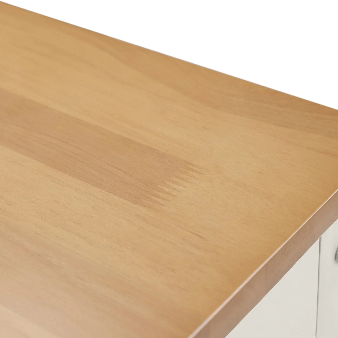 closeup of solid wood table top with natural grain and smooth corner