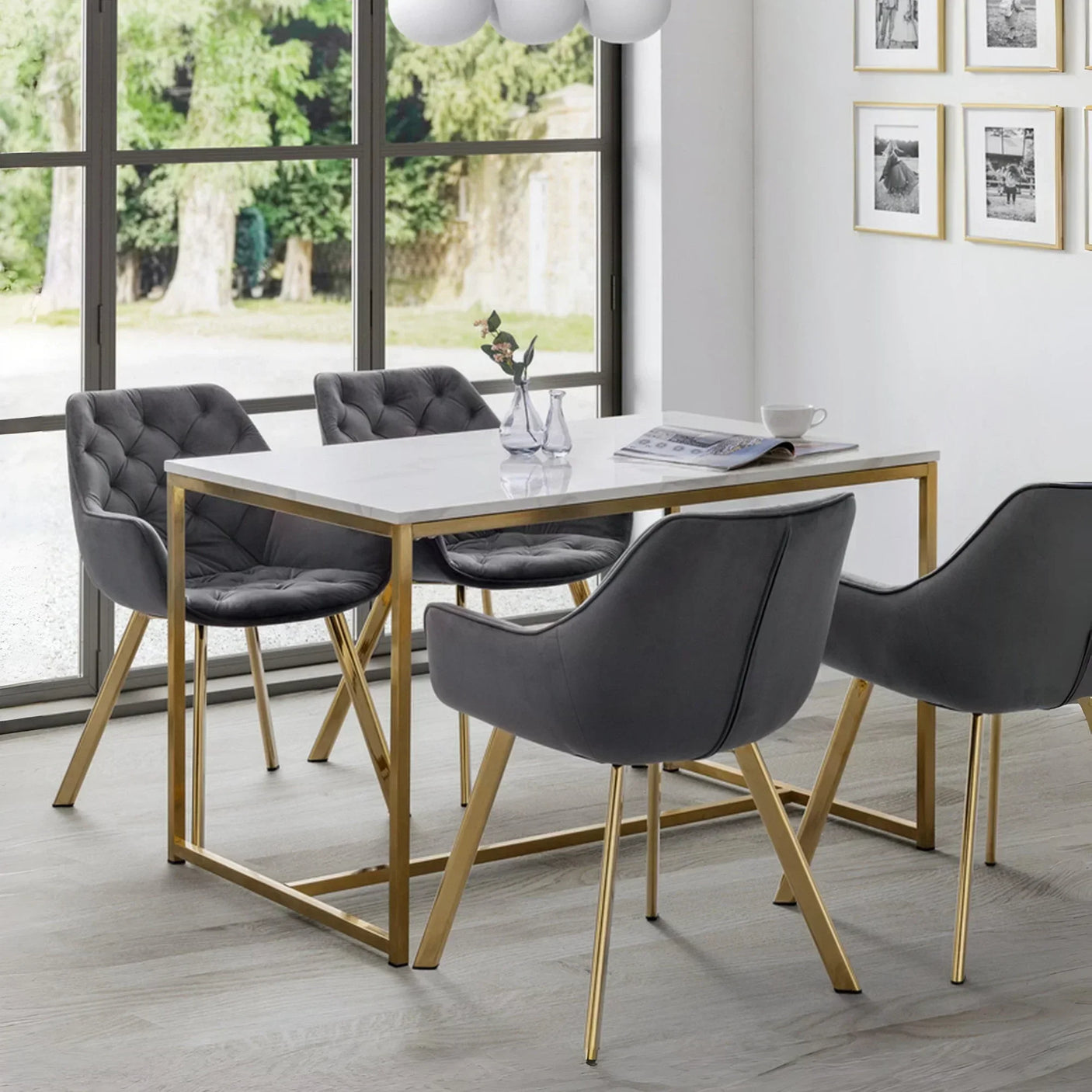 Grey velvet dining chairs with gold legs and white dining table in modern dining room