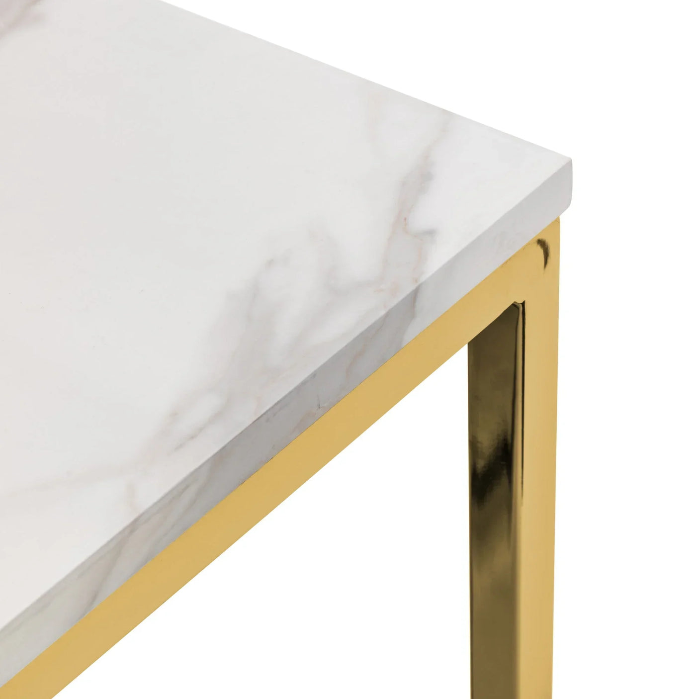 Corner of white marble top table with gold metal frame, close-up view