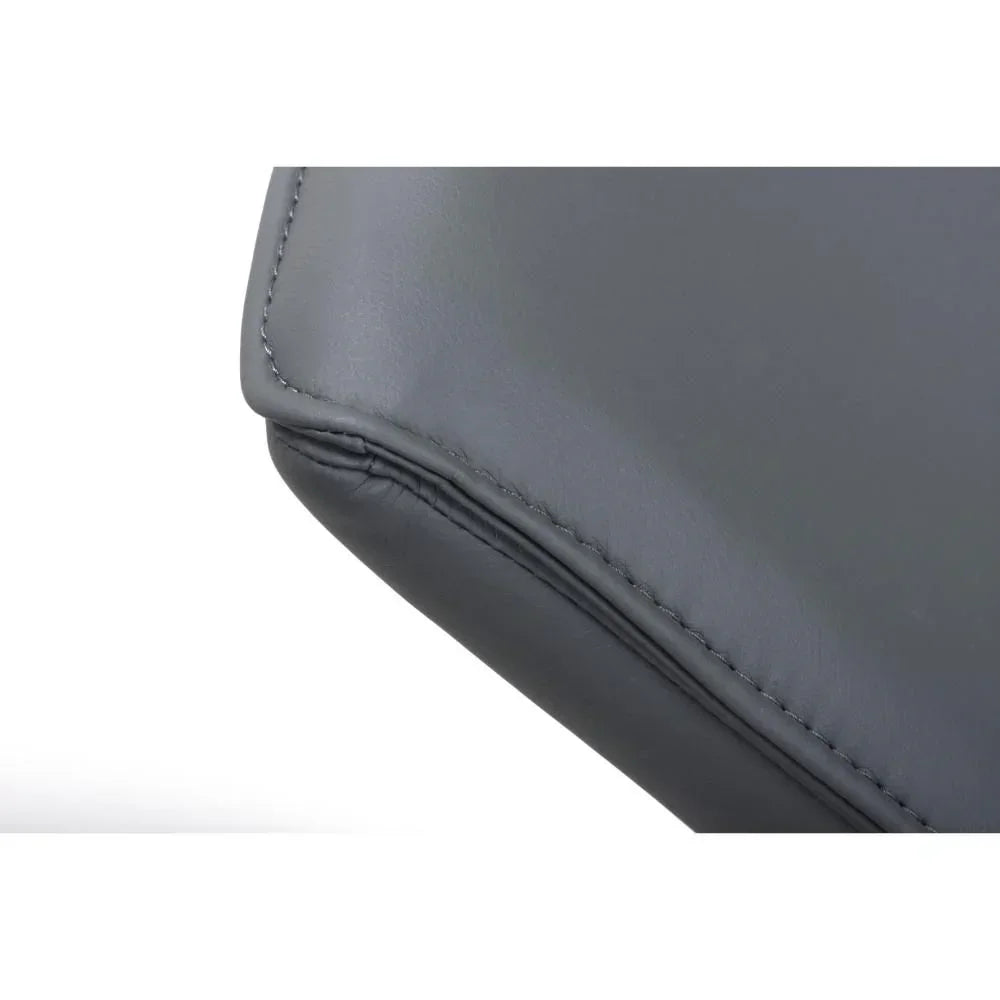 Close-up of grey leather sofa cushion with detailed stitching