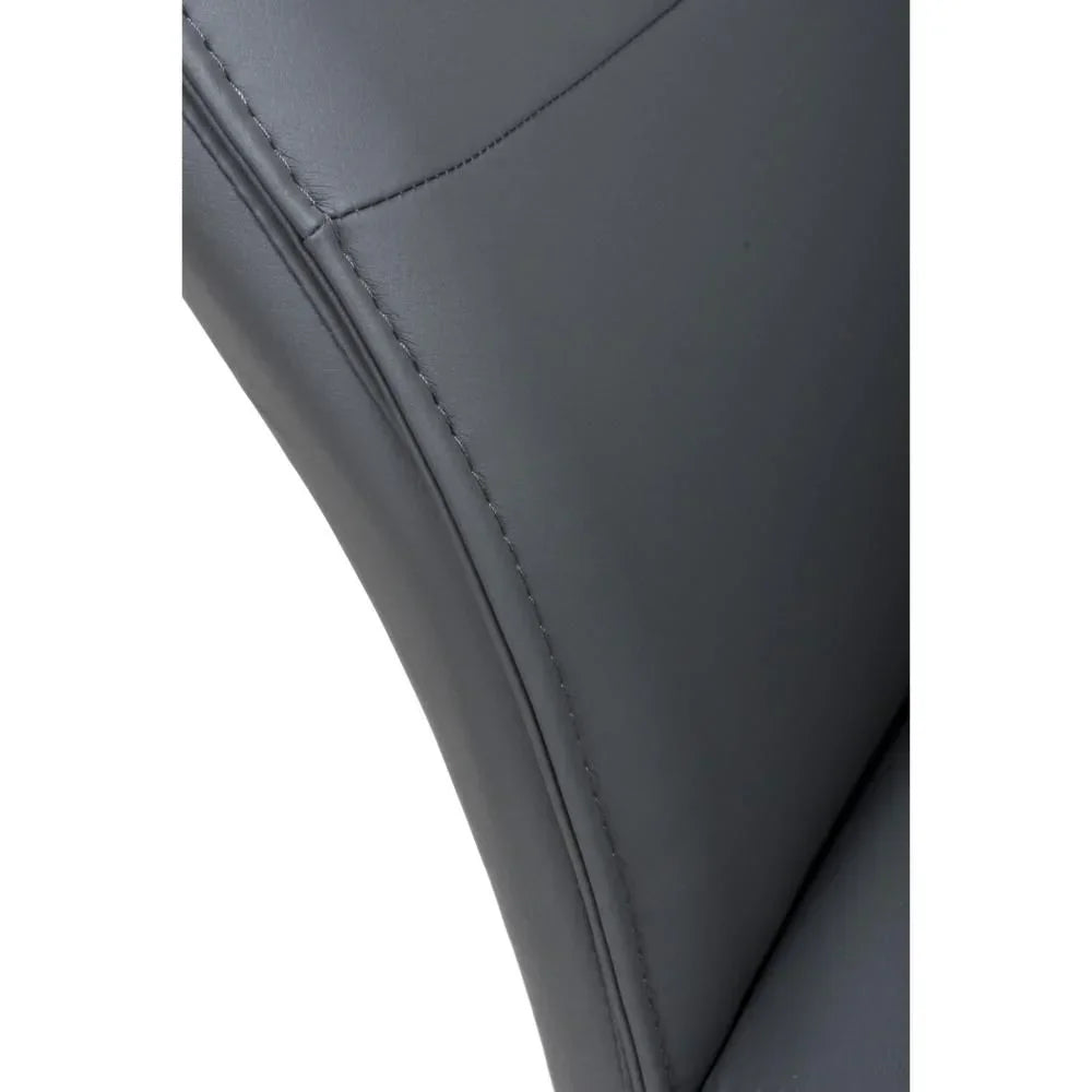 Close detail of grey faux leather dining chair upholstery and stitching