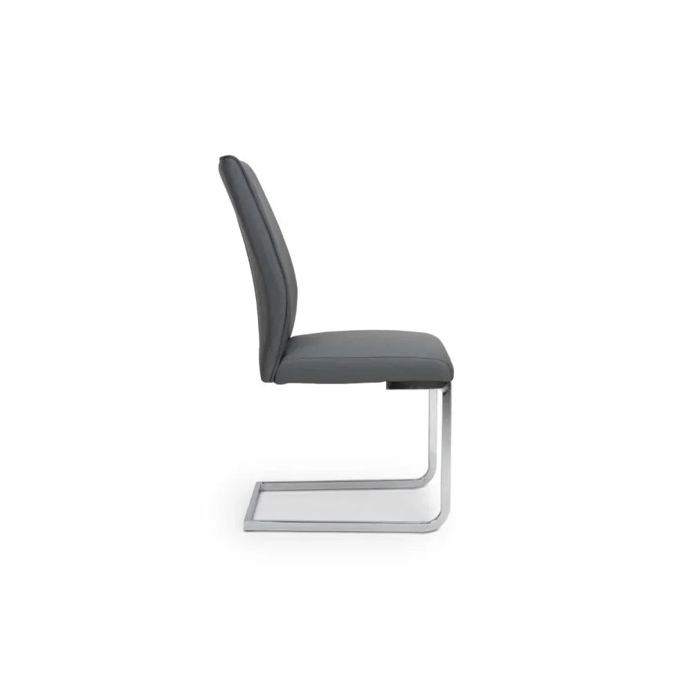Grey faux leather dining chair with chrome cantilever frame, side profile view