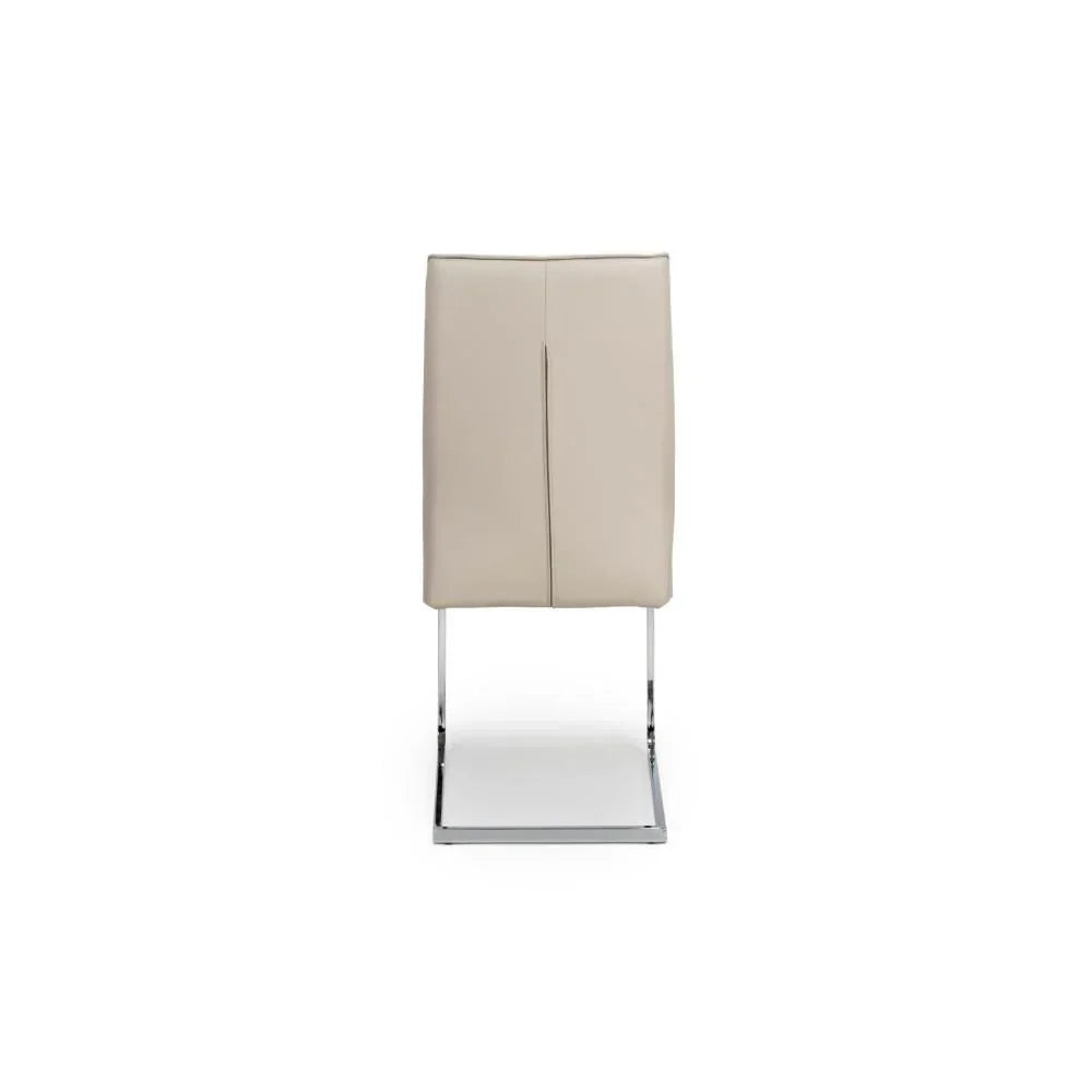 Beige dining chair with chrome cantilever base, viewed from the back
