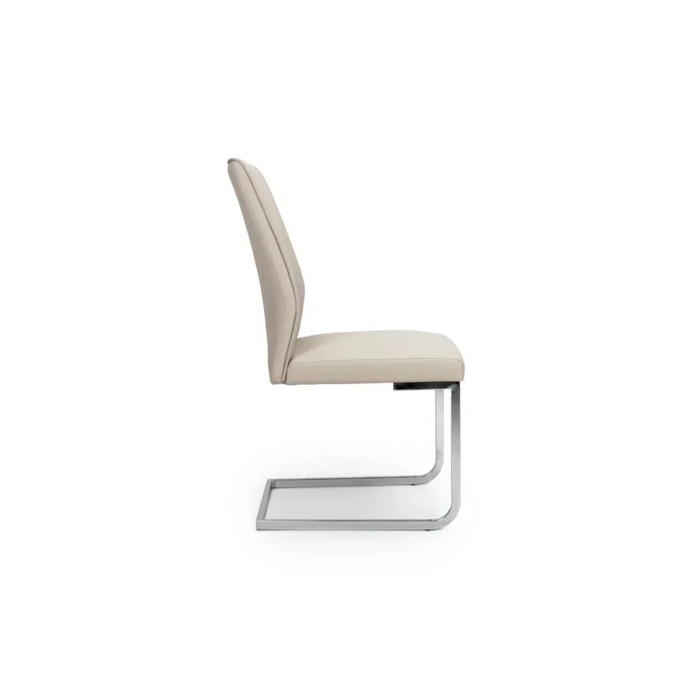Side view of cream dining chair with chrome cantilever frame and padded seat