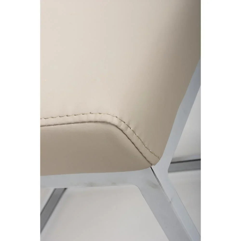 Beige dining chair with chrome metal frame and stitched seat corner detail