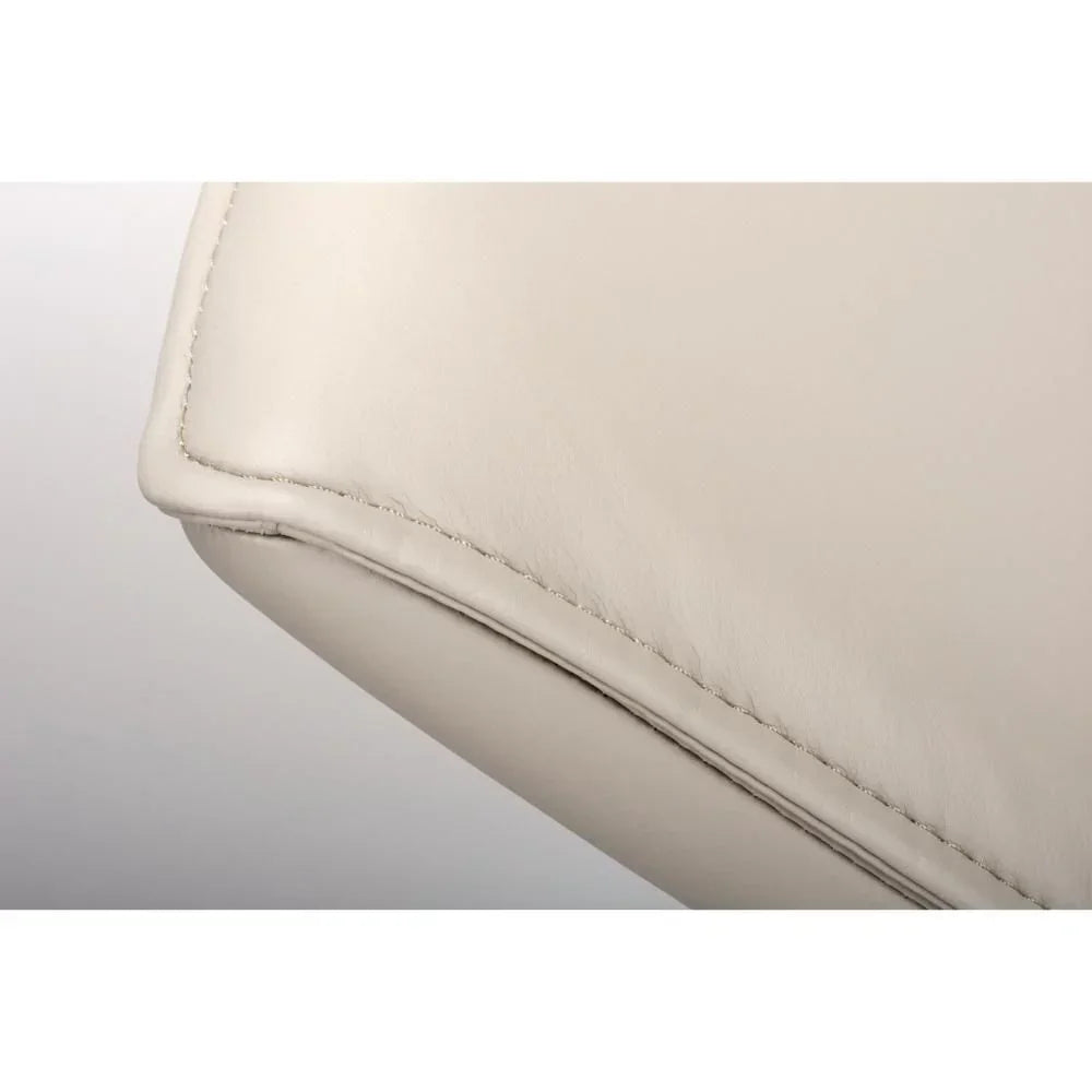 Close-up beige leather sofa cushion corner with detailed stitching