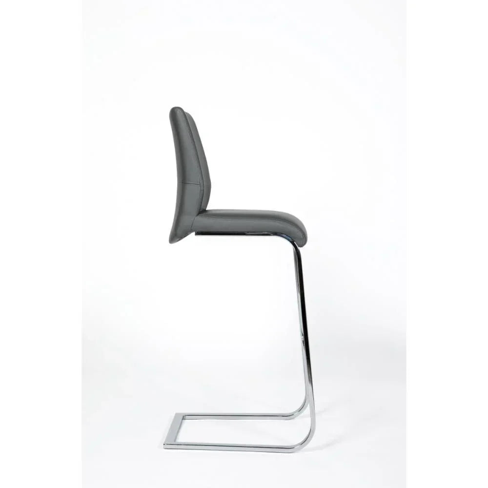 Grey bar stool with padded seat and chrome cantilever frame, side profile view