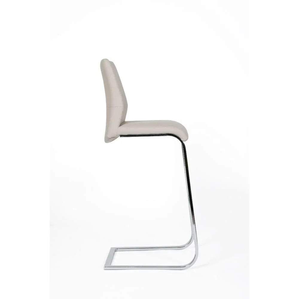 Beige bar stool with chrome cantilever base and padded seat side view